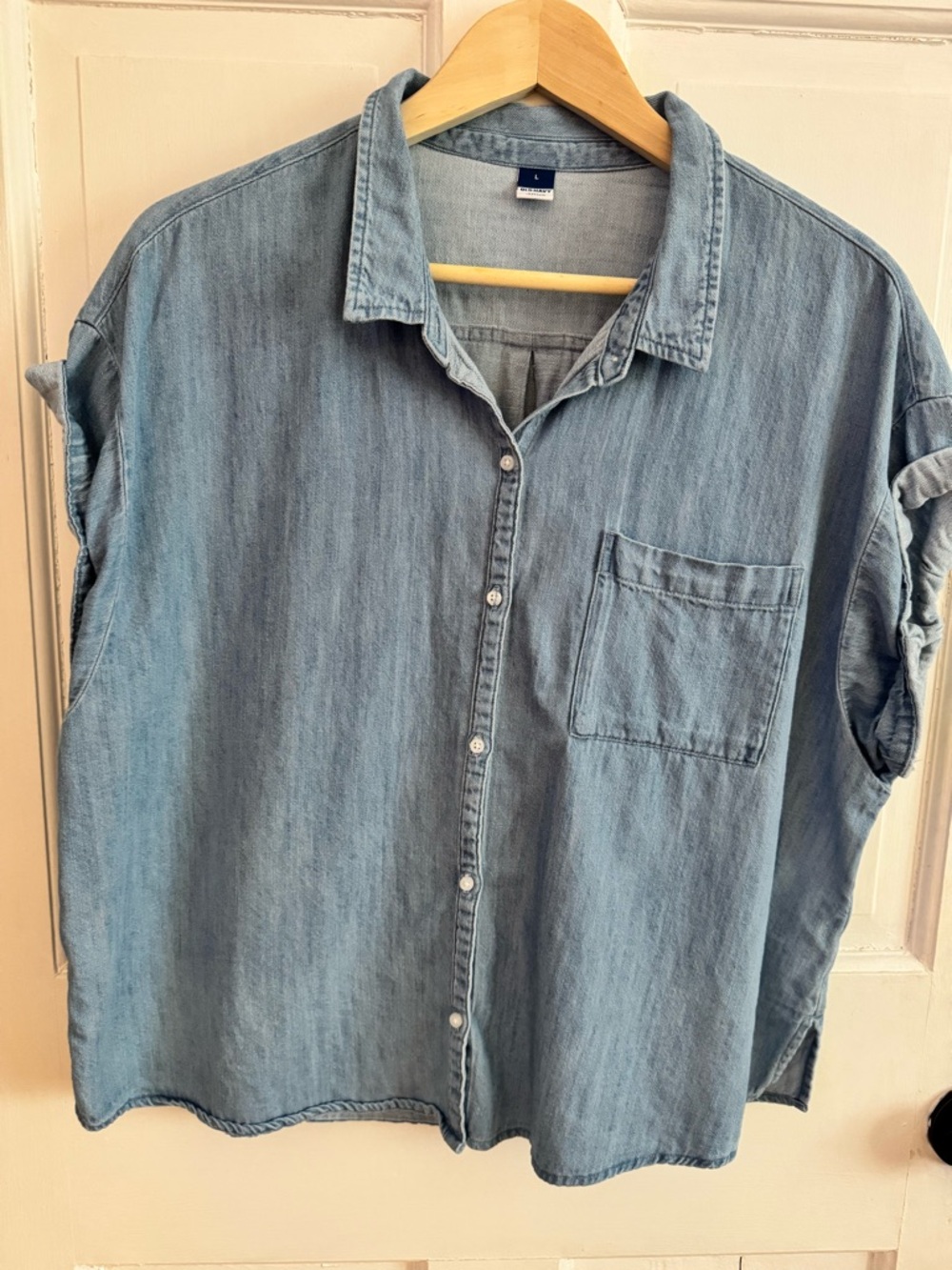 Soft Light Blue Denim rolled up short sleeve button down. 100 percent Cotton
